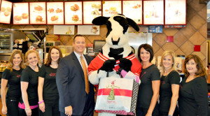 (Left to Right) Chasity Munn, SPM Board Liaison; Alison Haralson, SPM Co-Chair; Sherri Ebarb, SPM Co-Chair; Brent Kubala, Owner, Chick-fil-A Sugar Land; the Chick-fil-A cow; Catherine Kubala, SPM Co-Chair; Stephanie Van Horn, SPM Concessions Committee; and Cindy Reaves, SPM Concessions Committee.